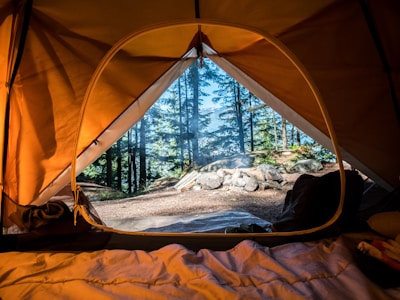 Tent lit from within at a remote campsite